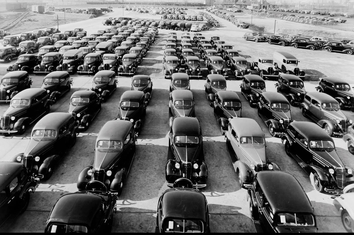 General Motors Chevrolet plant parking lot, Baltimore, late 1930s — rows of finished Chevrolets outside the Broening Highway facility